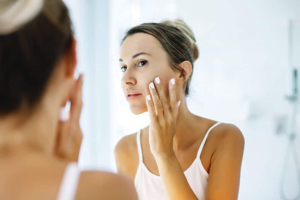 Woman looking on the Mirror