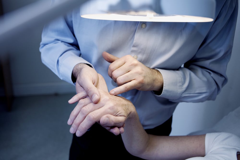 Elderly Person getting a dermatology check up